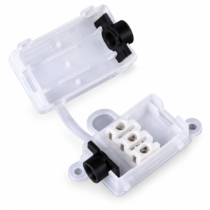 Clear mini junction connector open to show three terminals and black cable clamps